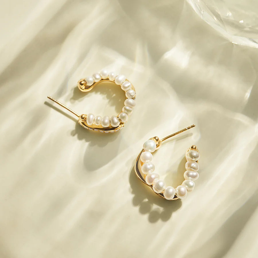 Exquisite diamond-encrusted pearl earrings